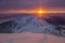 Trails leading to the top of a snowy mountain. Deep snow at sunset, alpine view, Carpathians, Marmaros