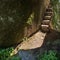 Trails and stairs through granite boulders on Penha Mountain, Portugal