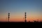 Train Approaching Railway Signals at Sunset on Canadian Prairie