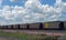 Train carrying coal in rural Nebraska, beautiful skies