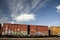 Train Cars with Graffiti Against a Blue Sky