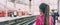 Train commuter woman going to work waiting for delayed tramway at station early morning panoramic banner background