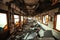 The train after the destruction. disaster. General frame of train debris from inside. From the windows warm spring light