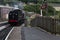 Train Driver reversing Steam Train at Keighley Railway Station on Keighley and Worth Valley Railway. Yorkshire, England, UK,