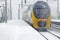 Train driving in snowstorm in winter in Amsterdam Netherlands