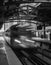 Train on elevated tracks within buildings at the Loop, Chicago City Center - Black and White with Long Exposure Artistic Effect -