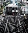 Train on elevated tracks within buildings at the Loop, Chicago City Center - Bleached Portrait Artistic Effect