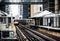 Train on elevated tracks within buildings at the Loop, Chicago City Center - Bleached Portrait Artistic Effect - Chicago