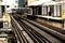 Train on elevated tracks within buildings at the Loop, Chicago City Center - Sepia Glow Artistic Effect