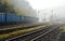 Train enters the station on a foggy morning