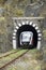 Train exit from railway stone tunnel