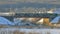 The train goes through railway bridge. Winter landscape