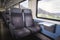 Train interior with empty seats. Swiss modern train wagon