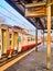 A train of in an Italian train station at sunset. Asti, Piedmont, Italy