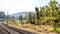 Train Journey In India on a mesmerizing railway tracks in Konkan Railway. Scenic train running in dense forests sides of Western