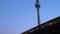 Train leaving Alexanderplatz Station tilt up to Berliner Fernsehturm Television Tower, Berlin, Germany