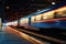 Train In Motion At Night, Its Lights Leaving Luminous Trails As It Arrives At Bustling Citys Railway