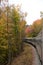 Train moving through the Adirondack Autumn wilderness