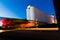 Train Moving Near Grain Silos