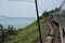 Train passes the sea, the hills, and jungle at the Hai Van Pass between Hue and Da Nang in Central Vietnam