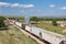 Train Passing Old Grain Elevator in South Dakota