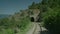 A train passing through a rocky area.