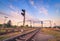 Train platform and traffic light at sunset. Railroad. Railway st