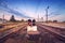 Train platform and traffic light at sunset. Railroad. Railway st