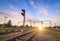 Train platform and traffic light at sunset. Railroad. Railway st