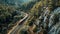 Train on railroad tracks through the mountain pass on bridge