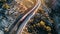 Train on railroad tracks through the mountain pass on bridge