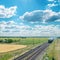 Train on railroad under cloudy sky