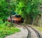 Train running beside the mountain