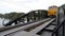 Train running on old iron bridge history railway of Kanchanaburi, thailand