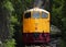 Train running on track between hellfire pass mountain and riverside Sai Yok waterfall and Khwae river bring thai people and