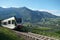 Train running Val Venosta valley route.