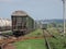 Train standing on siding on a sunny day in summer. Railway freight wagons and tanks of a different type and color