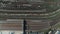 Train station with freight trains and containers in aerial view. Aerial shooting top down footage of railway