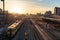 train station platform, with view of busy cityscape at sunrise