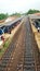 The train station in Sri Lanka. Lots of trash on a dirty railway