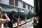 Train station staff pulldown rail level crossing barriers on road