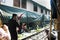 Train station staff pulldown rail level crossing barriers on road