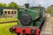 A train stationary getting up steam at a station in Rutland, UK