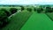 Train Tracks in Amish Countryside and Farmlands as Seen by Drone