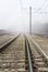 Train Tracks Disappear Into Fog