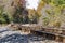 Train tracks disappearing into a rural autumn landscape