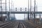 Train tracks in the mist pass under the Spokane Street Viaduct in Seattle
