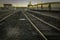 Train Tracks In Old Trainyard At Sunset