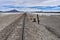 Train tracks running across the Salar de Chiguana in the Nor Lipez province, near Uyuni, Bolivia