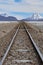 Train tracks running across the Salar de Chiguana in the Nor Lipez province, near Uyuni, Bolivia